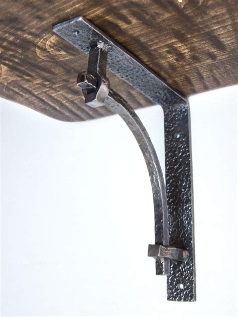 forged metal shelf brackets|wrought iron brackets for shelves.